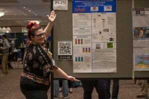 An enthusiastic presenter at a SICB poster session