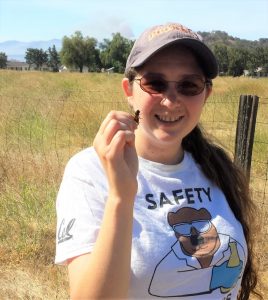Incoming DCPB student and postdoctoral affairs representative Lisa Treidel and one of her crickets, at Sedgwick reserve in Santa Ynez