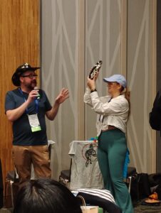 Kevin Kocot and Stormie Collins auctioning off a beautiful ceramic Chaetopterus dish. The DIZ auction has treasures you won’t find anywhere else.